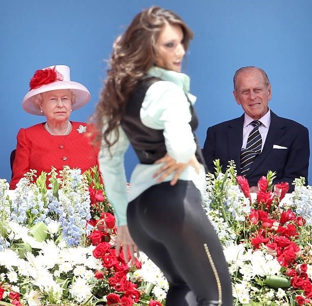Queen Elizabeth II and Prince Philip, Duke of Edinburgh watch a dancer perform during Canada Day celebrations on Parliament Hill on July 1, 2010 in...