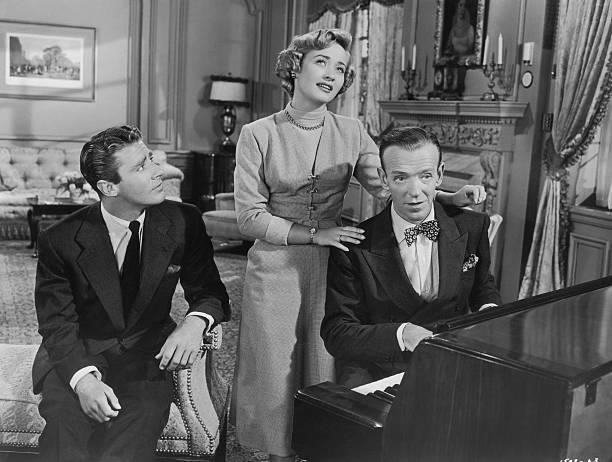 Actor Peter Lawford , actress Jane Powell and actor and dancer Fred Astaire pictured during a scene from the film, 'Wedding Bells', USA, circa 1951....