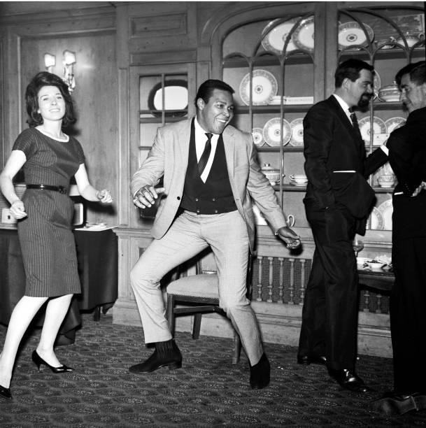 Chubby Checker, doing the twist at press reception, 1960.