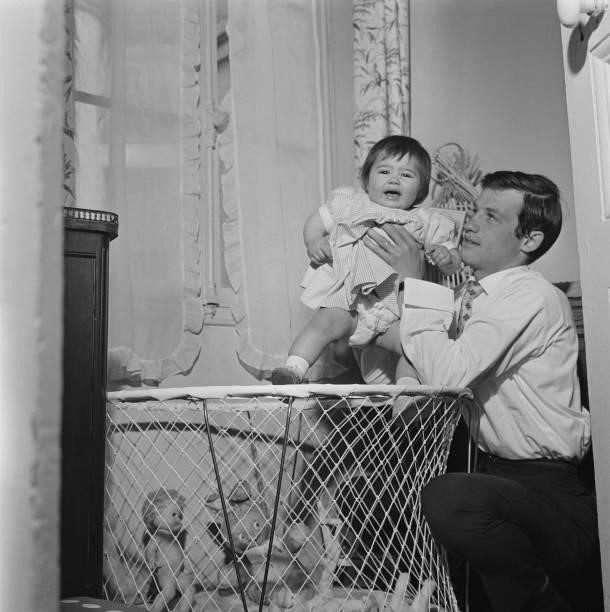 French actor Jean-Paul Belmondo with a little girl, circa 1960.
