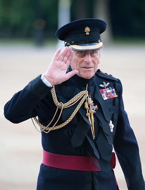 Prince Philip, Duke of Edinburgh waves as he arrives to take the Salute at the Household Division Beating Retreat outside the Guards Museum on June...