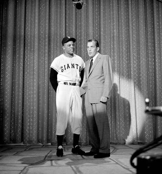 Ed Sullivan, right, talks with baseball great, Willie Mays on the CBS television show "Toast of the Town