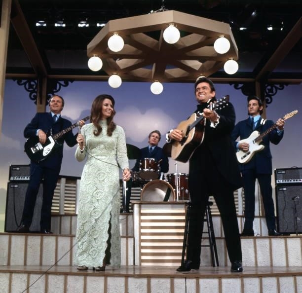 Pictured from left is June Carter Cash and Johnny Cash performing on THE JIM NABORS HOUR, a CBS television variety, music show. Episode aired March...