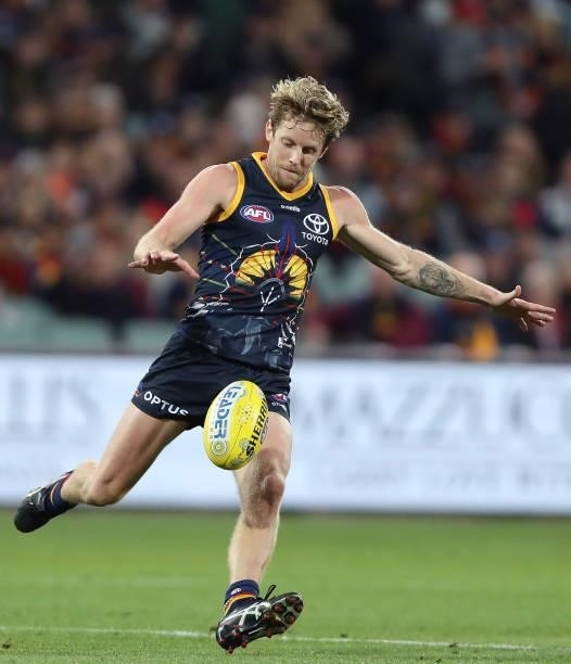 Rory Sloane of the Crows kicks the ball during the 2021 AFL Round 12 match between the Adelaide Crows and the Collingwood Magpies at Adelaide Oval on...