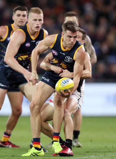 Paul Seedsman of the Crows handpasses the ball during the 2021 AFL Round 12 match between the Adelaide Crows and the Collingwood Magpies at Adelaide...