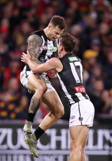 Jamie Elliott of the Magpies celebrates a goal with Callum L. Brown during the 2021 AFL Round 12 match between the Adelaide Crows and the Collingwood...