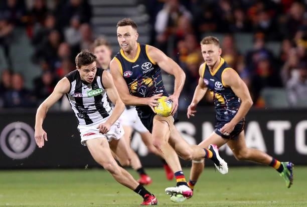 Brodie Smith of the Crows runs forward during the 2021 AFL Round 12 match between the Adelaide Crows and the Collingwood Magpies at Adelaide Oval on...