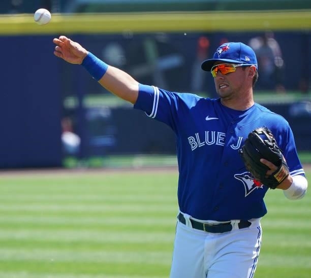 Joe Panik of the Toronto Blue Jays throws a ball before the game against the Houston Astros at Sahlen Field on June 5, 2021 in Buffalo, New York.
