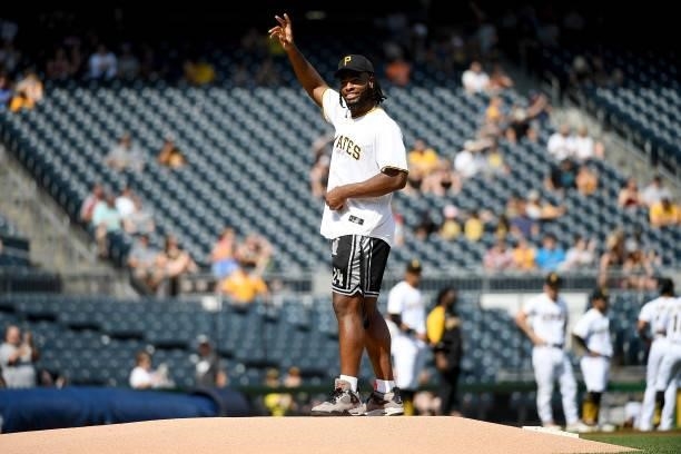 Pittsburgh Steelers First Round Pick Najee Harris waves to the crowd before throwing out the first pitch before the start of the game between the...