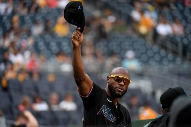 Starling Marte of the Miami Marlins waves to the crowd following a video tribute of his time with the Pittsburgh Pirates in the first inning during...