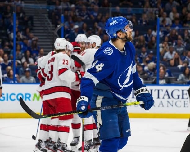 The Carolina Hurricanes celebrate a goal against Jan Rutta and the Tampa Bay Lightning during the second period in Game Four of the Second Round of...