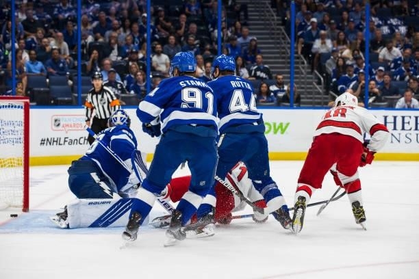 Goalie Andrei Vasilevskiy of the Tampa Bay Lightning gives up a goal against Jesper Fast of the Carolina Hurricanes during the second period in Game...