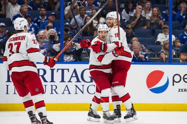 The Carolina Hurricanes celebrate a goal by Dougie Hamilton against the Tampa Bay Lightning during the second period in Game Four of the Second Round...