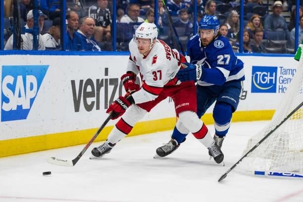 Ryan McDonagh of the Tampa Bay Lightning skates against Andrei Svechnikov of the Carolina Hurricanes during the second period in Game Four of the...