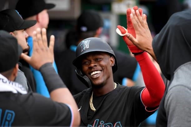 Jazz Chisholm Jr. #2 of the Miami Marlins celebrates with teammates in the dugout after hitting a two run home run in the fourth inning during the...