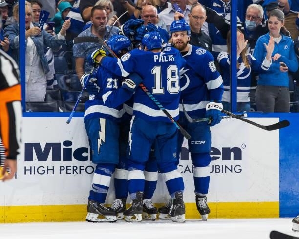 Nikita Kucherov of the Tampa Bay Lightning celebrates a goal with teammates against the Carolina Hurricanes during the third period in Game Four of...