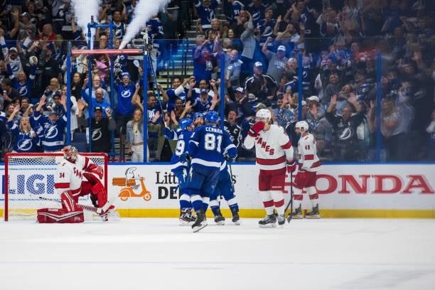 Tyler Johnson of the Tampa Bay Lightning celebrates a goal with teammates against the Carolina Hurricanes during the second period in Game Four of...