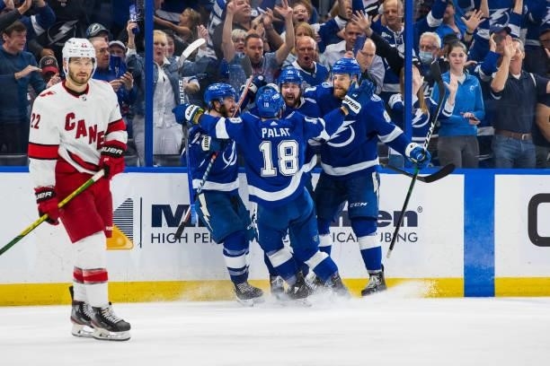 Nikita Kucherov of the Tampa Bay Lightning celebrates a goal with teammates against the Carolina Hurricanes during the third period in Game Four of...