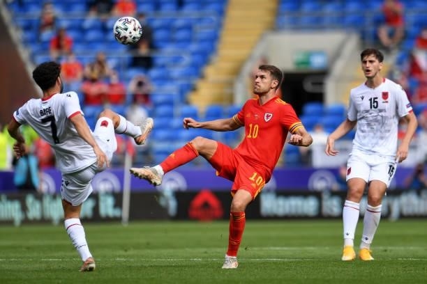Keidi Bare of Albania under pressure from Aaron Ramsey of Wales during the International Friendly Match between Wales and Albania at the Cardiff City...