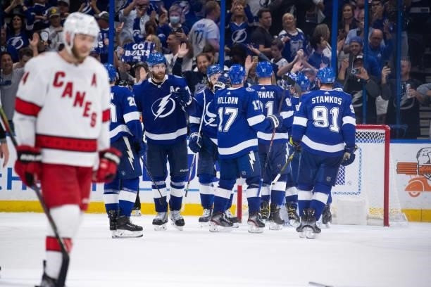 The Tampa Bay Lightning celebrate the win against the Carolina Hurricanes in Game Four of the Second Round of the 2021 Stanley Cup Playoffs at Amalie...