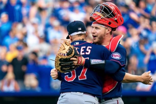 Hansel Robles of the Minnesota Twins and Ryan Jeffers celebrate after defeating the Kansas City Royals at Kauffman Stadium on June 5, 2021 in Kansas...