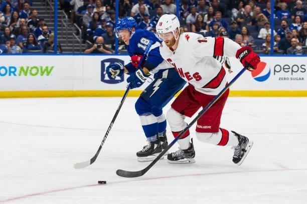 Ondrej Palat of the Tampa Bay Lightning skates against Dougie Hamilton of the Carolina Hurricanes during the three period in Game Four of the Second...