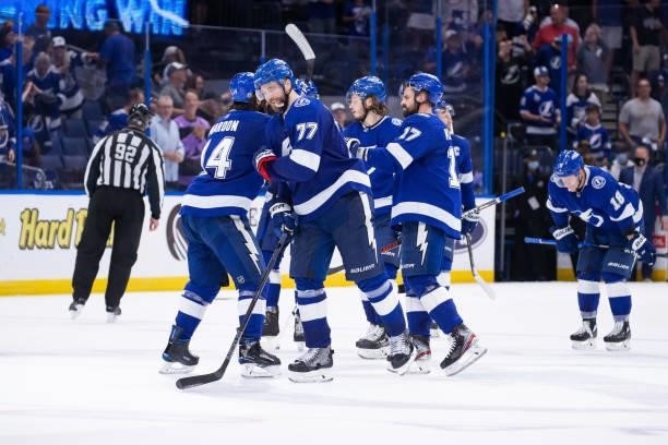 The Tampa Bay Lightning celebrate the win against the Carolina Hurricanes in Game Four of the Second Round of the 2021 Stanley Cup Playoffs at Amalie...