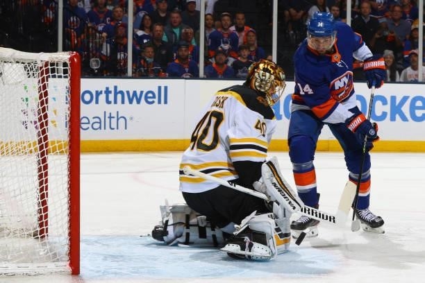 Travis Zajac of the New York Islanders attempts a shot against Tuukka Rask of the Boston Bruins during the first period in Game Four of the Second...