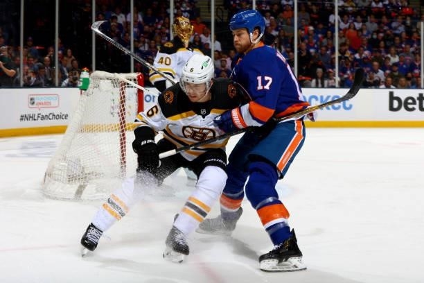 Matt Martin of the New York Islanders and Mike Reilly of the Boston Bruins battle for position during the first period in Game Four of the Second...
