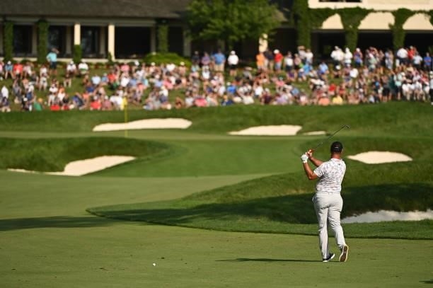 Jon Rahm of Spain hits a shot on the 18th fairway during the third round of the Memorial Tournament presented by Nationwide at Muirfield Village Golf...