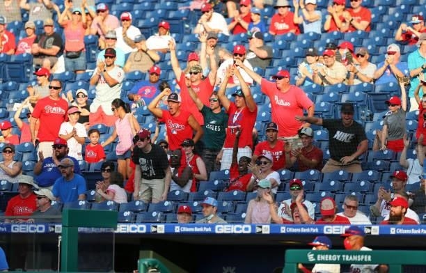 Philadelphia Phillies fans cheer after the third out in the eighth inning during a game against the Washington Nationals at Citizens Bank Park on...