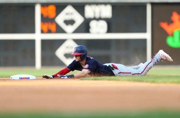 Trea Turner of the Washington Nationals slides into second base with a double in the seventh inning during a game against the Philadelphia Phillies...