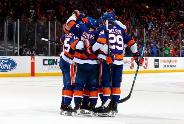 The New York Islanders celebrate a goal by Casey Cizikas against the Boston Bruins during the third period in Game Four of the Second Round of the...
