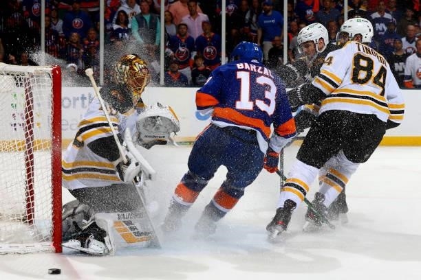 Mathew Barzal of the New York Islanders attempts a shot on goal against Tuukka Rask of the Boston Bruins during the third period in Game Four of the...