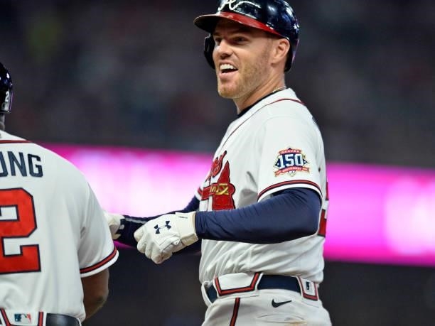 Freddie Freeman of the Atlanta Braves reacts to his base hit in the fifth inning against the Los Angles Dodgers at Truist Park on June 5, 2021 in...