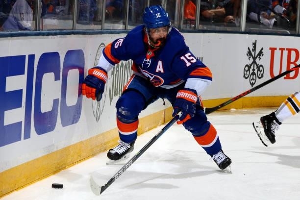 Cal Clutterbuck of the New York Islanders handles the puck against the Boston Bruins during the third period in Game Four of the Second Round of the...