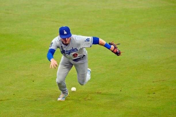 Gavin Lux of the Los Angeles Dodgers misses a ground ball hit by Austin Riley of the Atlanta Braves in the fourth inning at Truist Park on June 5,...