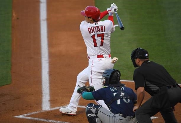 Shohei Ohtani of the Los Angeles Angels hits a solo home run in the first inning of the game against the Seattle Mariners at Angel Stadium of Anaheim...