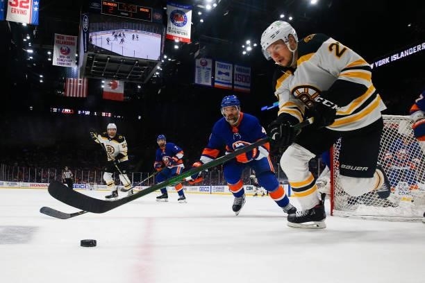 Curtis Lazar of the Boston Bruins handles the puck against Andy Greene of the New York Islanders during the third period in Game Four of the Second...