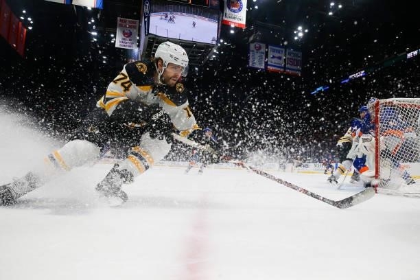 Jake DeBrusk of the Boston Bruins races for the puck against the New York Islanders during the third period in Game Four of the Second Round of the...