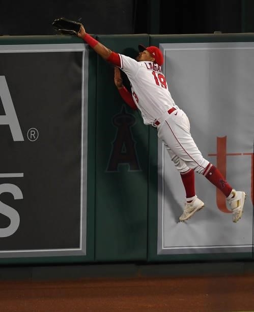 Jose Rojas of the Los Angeles Angels fails to catch and deny a grand slam home run by Jake Fraley of the Seattle Mariners in the fourth inning at...