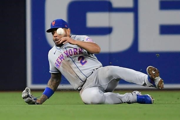 Dominic Smith of the New York Mets fails to make the catch on a single hit by Eric Hosmer of the San Diego Padres during the fourth inning of a...