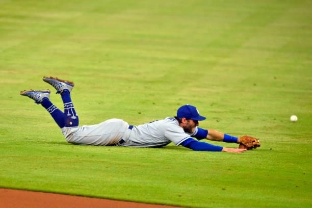Chris Taylor of the Los Angeles Dodgers misses a hit by Kevan Smith of the Atlanta Braves in the bottom of the eighth inning at Truist Park on June...