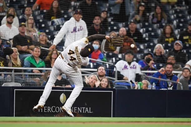 Joe Musgrove of the San Diego Padres fails to make the catch on a foul ball hit by Dominic Smith of the New York Mets during the fifth inning of a...