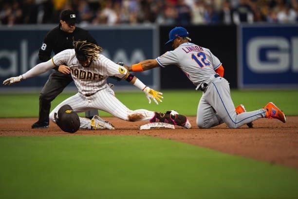 Fernando Tatis Jr. #23 of the San Diego Padres slides into second base for a double in the second inning against the New York Mets at Petco Park on...