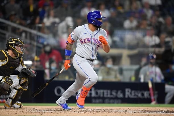 Dominic Smith of the New York Mets hits a single during the fourth inning of a baseball game against San Diego Padres at Petco Park on June 5, 2021...