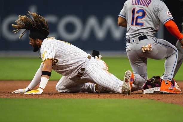 Fernando Tatis Jr. #23 of the San Diego Padres slides into second base for a double in the second inning against the New York Mets at Petco Park on...