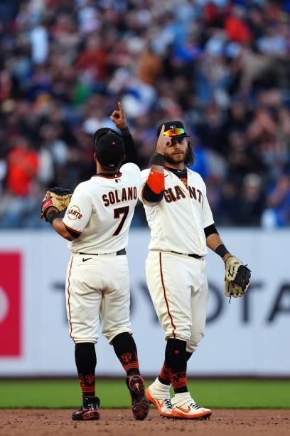 Donovan Solano of the San Francisco Giants celebrates with Brandon Crawford after winning the game between the Chicago Cubs and the San Francisco...