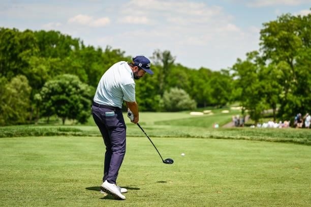Mark Hubbard makes impact as he plays his shot from the first tee during the third round of the Memorial Tournament presented by Nationwide at...