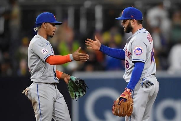 Francisco Lindor of the New York Mets is congratulated by Jose Peraza after beating the San Diego Padres 4-0 in a baseball game at Petco Park on June...